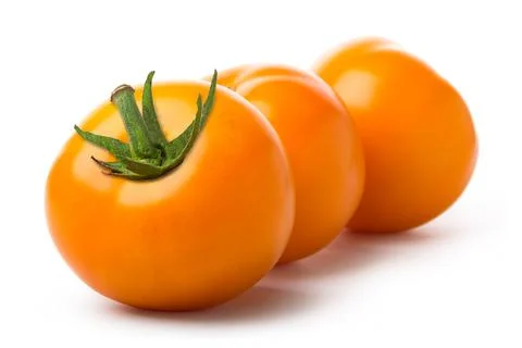 Three yellow tomatoes Stock Photos