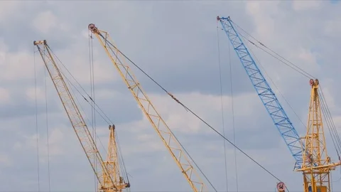 Three yellow tower cranes Stock Footage 69825006