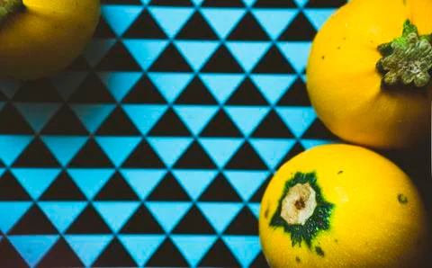 Three yellow zuccini on a geometry pattern Stock Photos