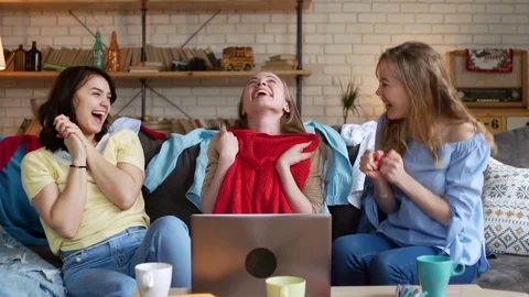Three young active women make online payment for order by card while shopping Stock Footage 75963155