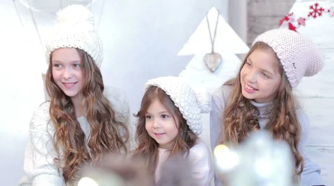 Three young beautiful girls in winter hat Stock Footage 59139397