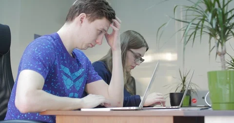 Three Young Business People Using Computer in the Office. Two Decorator's Stock Footage 113302658