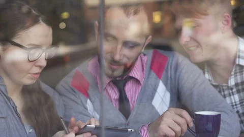 Three young, creative and business people in a cafe Stock-Footage 85224372