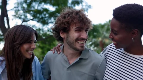 Three young diverse hanging out at city street. Stock Footage 310780571