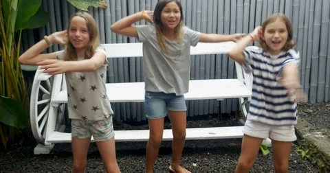 Three young diverse racial group of young pre teen girls dancing together Stock Footage 85355802