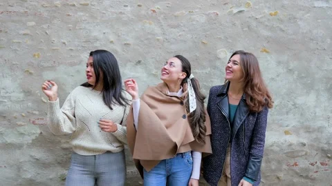 Three young excited females pointing to something at distance. Stock Footage 166300461