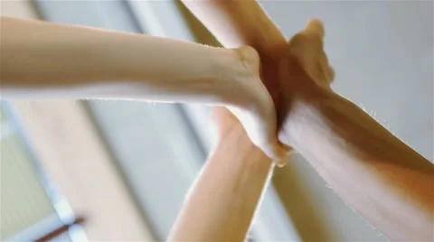 Three young friends congratulate each other slapping hands Stock Footage 54938157
