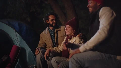 Three young laughing group nice friends enjoying sitting together at winter Stock Footage 255166606