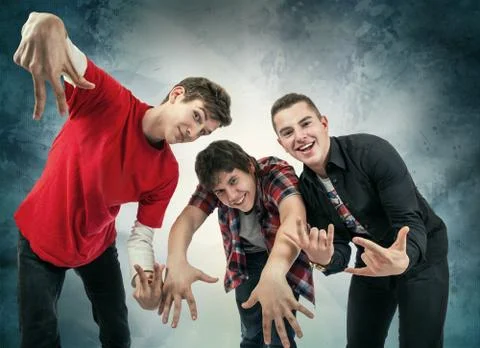 Three young man in fun hip hop poses Stock Photos