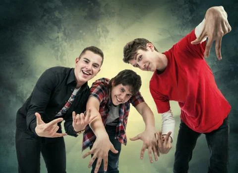 Three young man in fun hip hop poses Stock Photos