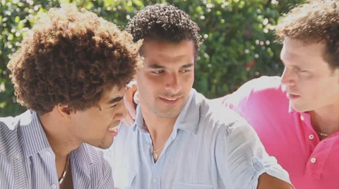 Three young men of mixed race laughing hysterical &amp; playful to camera Stock Footage 38762212