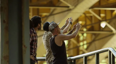 Three young men photographing with mobile phone Video stock 61274378