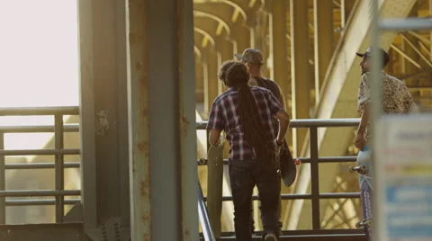 Three young men with skateboard walking on the bridge Video stock 61274396