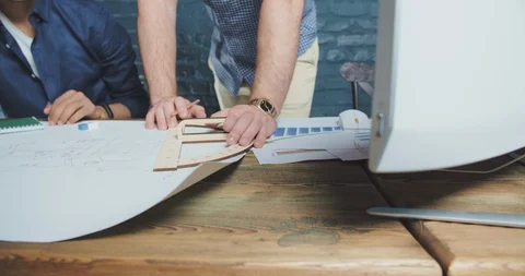 Three young multiethnic architectors brainstorming. Students working on project Video stock 107748262