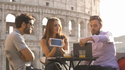 Three young people working together on a project with laptop and tablet Stock Footage 85601409