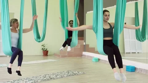 Three young woman doing flexibility exercises Stock Footage 194680985