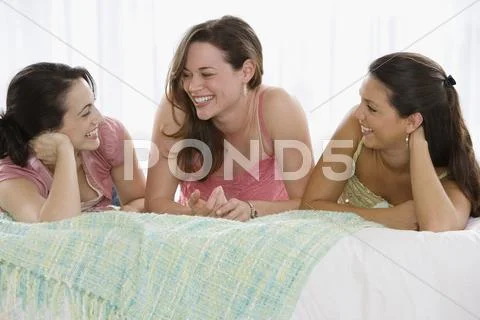 Three young women talking Stock Photos