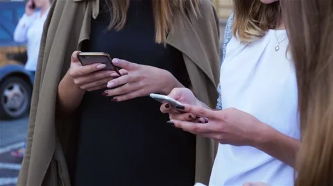 Three young women using mobile phone. 스톡 동영상 67780451
