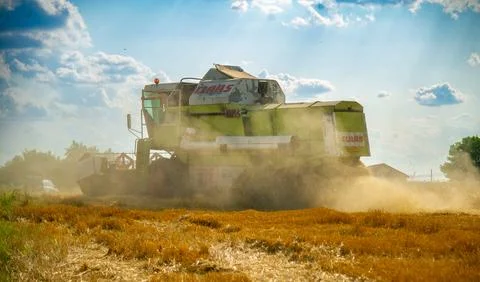 Threshing machine on the field Stock Photos