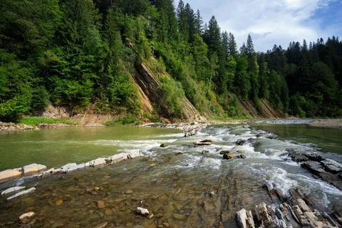 Threshold of a mountain river, among mountains Stock Photos