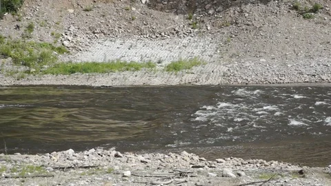 Threshold of a mountain river. rapid flow of water in the river Video stock 79325661
