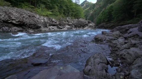 Thresholds of the beautiful mountain river against the wood Video stock 55525859