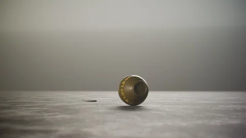 Threw lemon M26 hand grenade rotating on concrete floor with safety pin. 4k HD Stock Footage 119972025