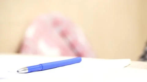 Threw the pen on the table and left Stock Footage 138805560