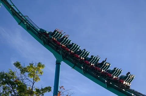 Thrill Seekers Enjoying a Roller Coaster Ride Stock Photos