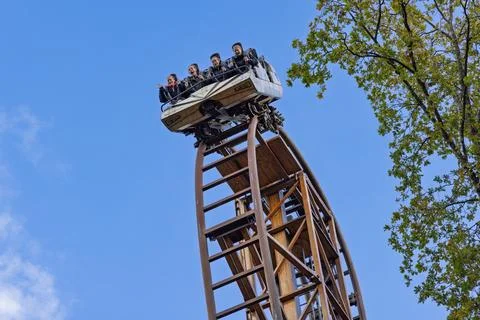 Thrill-seekers on the Falcon roller coaster at Duinrell plunge vertically dow Stock Photos