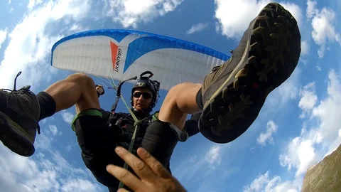 Thrill-seeking couple go on BASE jumping date Stock Footage 109254924