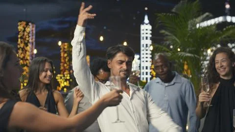 Thrilled man cheering and dancing at anniversary party Stock Photos