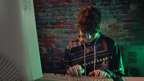 Thrilled Programmer or Hacker From 1980's Celebrating Breakthrough in Front of Stock Footage 298110176
