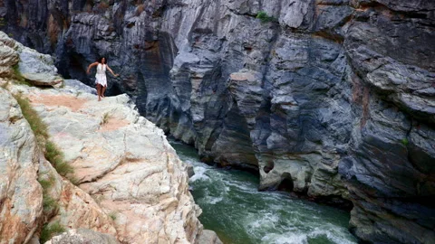 A Thrilling Adventure at the Canyons Edge: Capturing the Spirit of Exploration Stock Footage 314393379