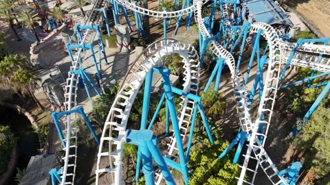 A thrilling aerial shot of a roller coaster in an amusement park Stock Footage 294261875