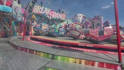 Thrilling Breakdance Fairground Attraction Spinning Ride Stock Footage 343232246