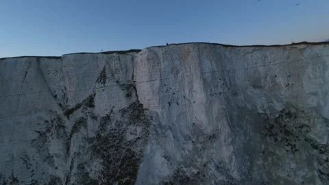Thrilling first person view of soaring and diving along the iconic white cliffs Stock Footage 332204665