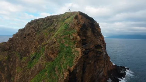 Thrilling FPV drone dive down the cliffs of Ilheu Mole in Porto Moniz, Madeira Stock Footage 308448028