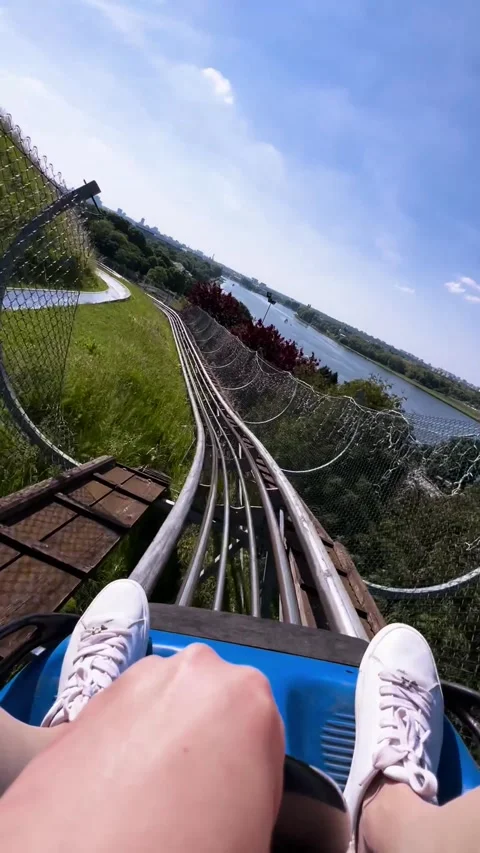 Thrilling Ride Down a Scenic Roller Coaster Stock Footage 289144159