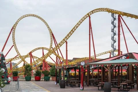 Thrilling roller coaster under a cloudy sky at amusement park Stock-Fotos