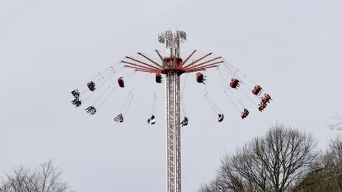 Thrilling swing ride experience on fun fair Stock Footage 310638588