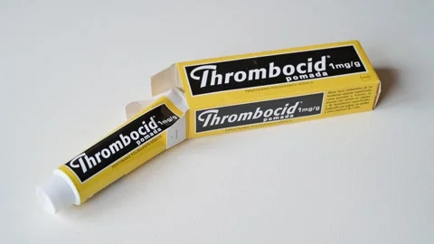 Thrombocid Ointment Tubes On White Surface For Medical Care And Pain Relief Video stock 325417985