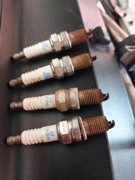 Throttle body, sensor, and spark plug service in car engine Fotos de archivo