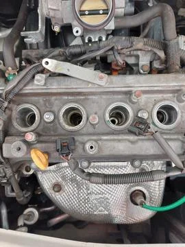 Throttle body, sensor, and spark plug service in car engine 스톡 사진