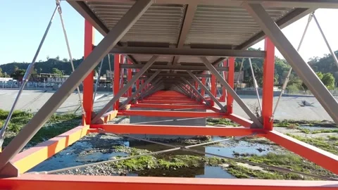 Through the Bottom Structure of a Bridge Stock Footage 240040823