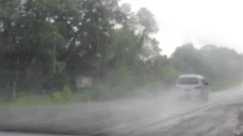 Through the car window it rains Stock Footage 80731824