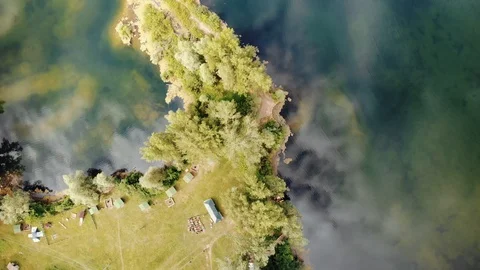 Through the clear water can be seen the bottom of the lake. Stock Footage 106193679