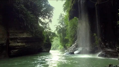 Through cliffs and caves along the river Stock Footage 75700129