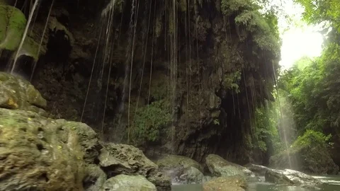Through cliffs and caves along the river Stock Footage 75700164