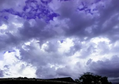 Through the clouds over the sea a ray of sunshine makes its way Foto stock